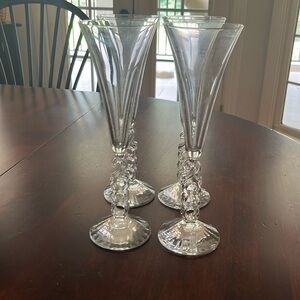 Four fluted champagne glasses